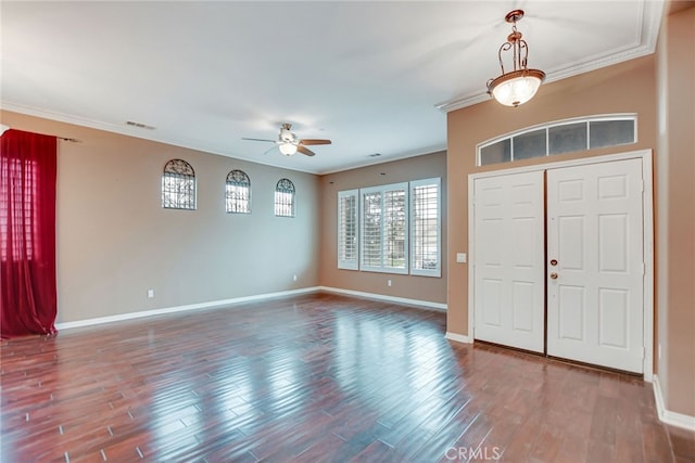 foyer featuring crown molding, ceiling fan, and dark hardwood / wood-style flooring