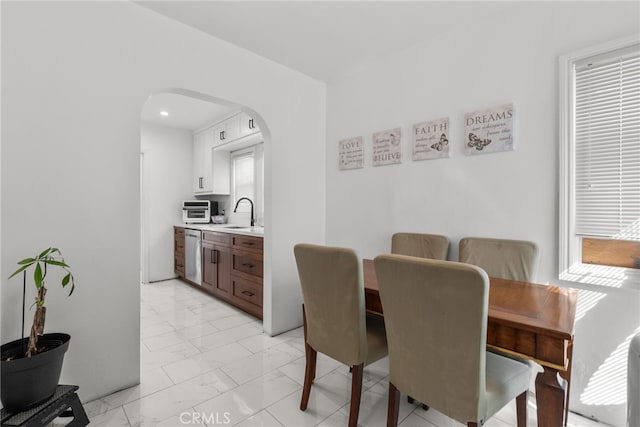 dining space featuring sink