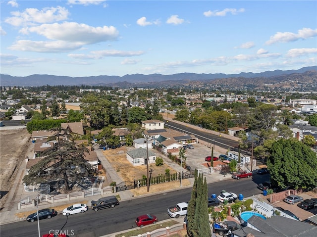 birds eye view of property with a mountain view