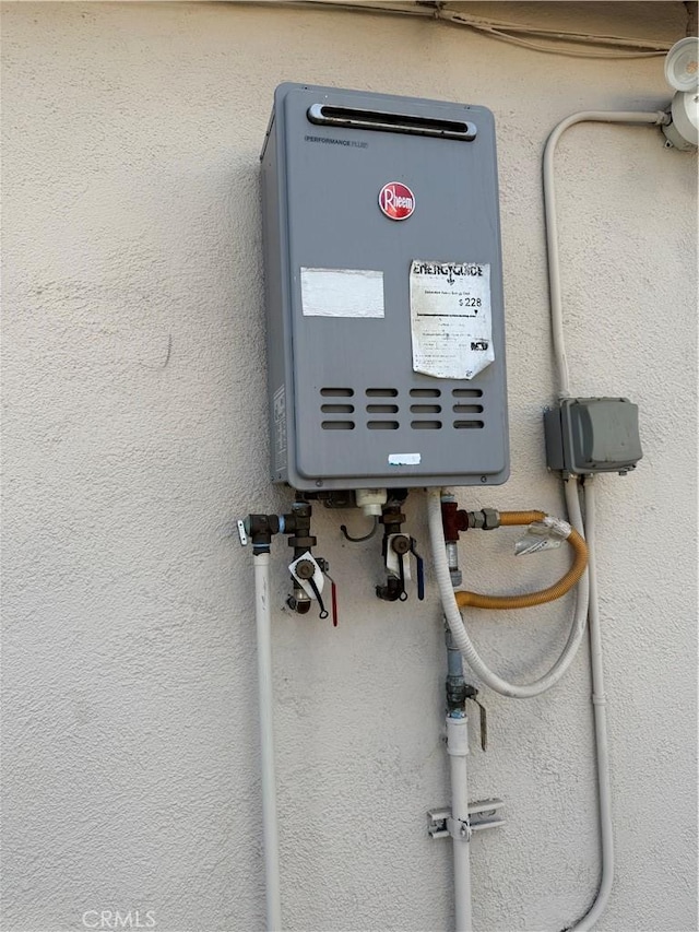 utility room with water heater