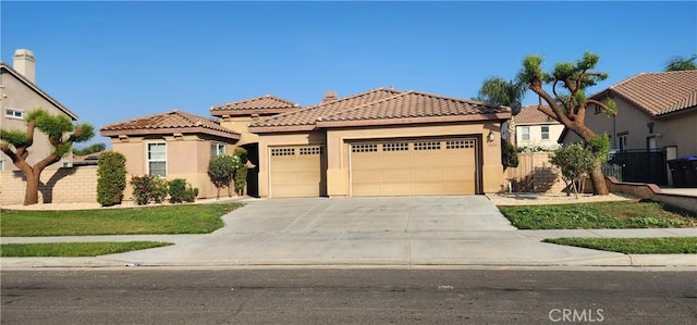 mediterranean / spanish-style home featuring a garage