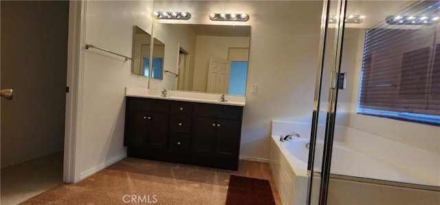 bathroom with vanity and independent shower and bath