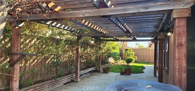 view of patio with cooling unit and a pergola