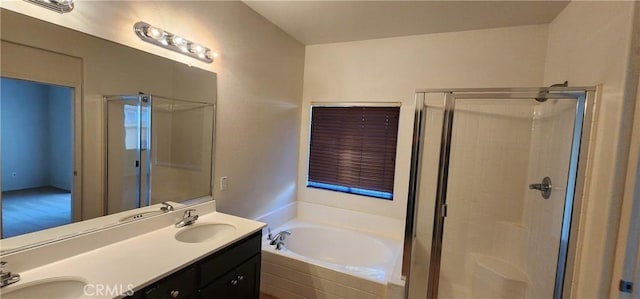 bathroom with vanity and shower with separate bathtub