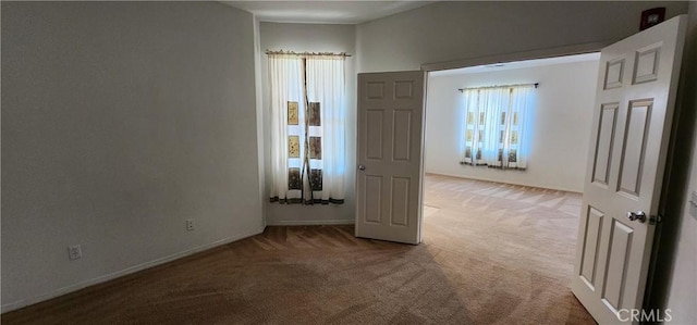 empty room featuring carpet flooring