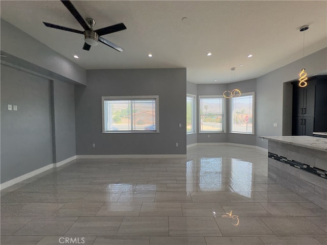 unfurnished room featuring ceiling fan