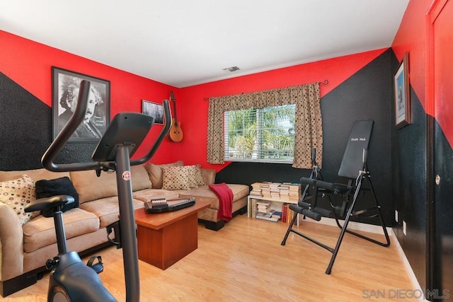 workout area featuring light hardwood / wood-style flooring