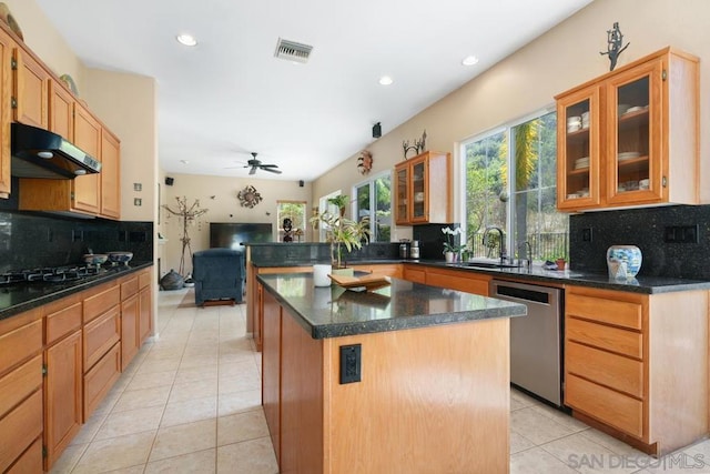 kitchen featuring dishwasher, ventilation hood, a center island, light tile patterned floors, and ceiling fan