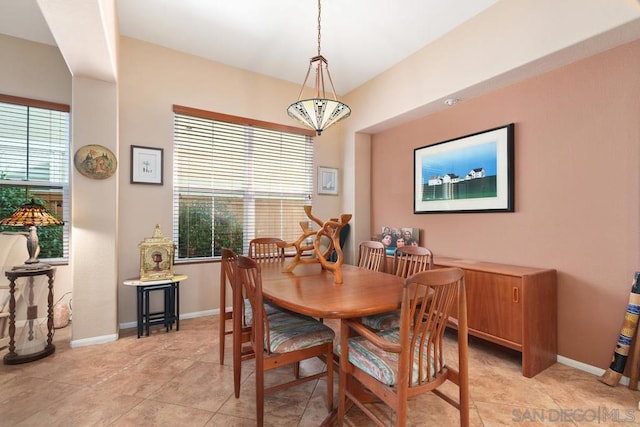 dining space with light tile patterned flooring