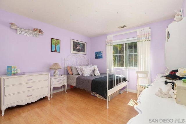 bedroom with light hardwood / wood-style flooring