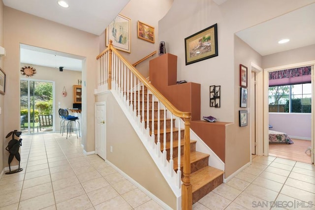 stairs with tile patterned floors