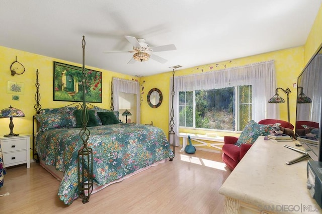 bedroom featuring light wood-type flooring and ceiling fan