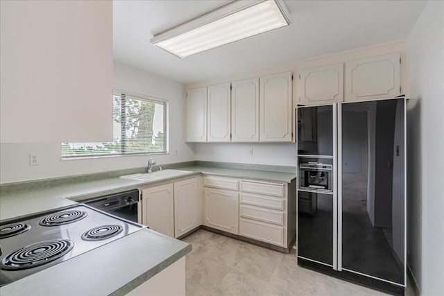 kitchen featuring sink and black appliances