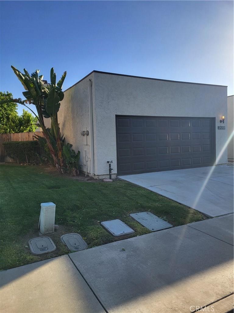 garage featuring a lawn