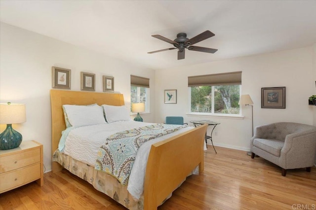 bedroom with light hardwood / wood-style flooring and ceiling fan