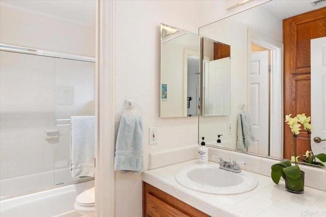 full bathroom with shower / tub combination, vanity, and toilet