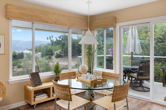 sunroom / solarium with a mountain view