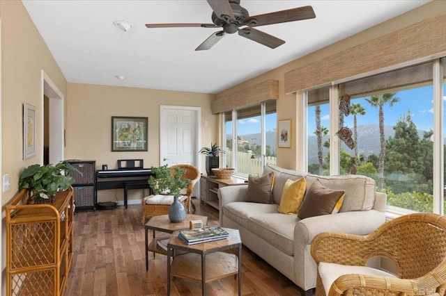 sunroom / solarium featuring ceiling fan