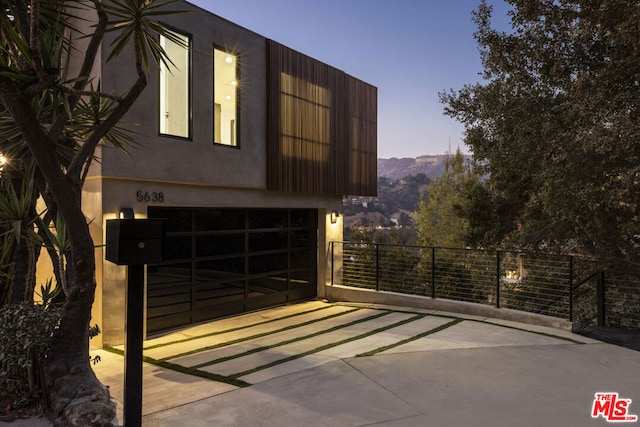 exterior space with a mountain view and a garage