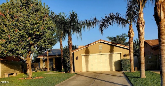 view of front of house with a front lawn and a garage