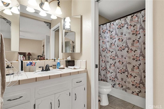 full bathroom featuring toilet, tile patterned flooring, shower / bathtub combination with curtain, and vanity