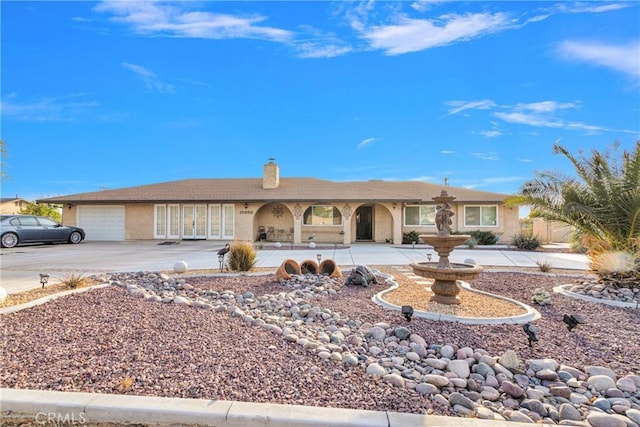 ranch-style house featuring a garage