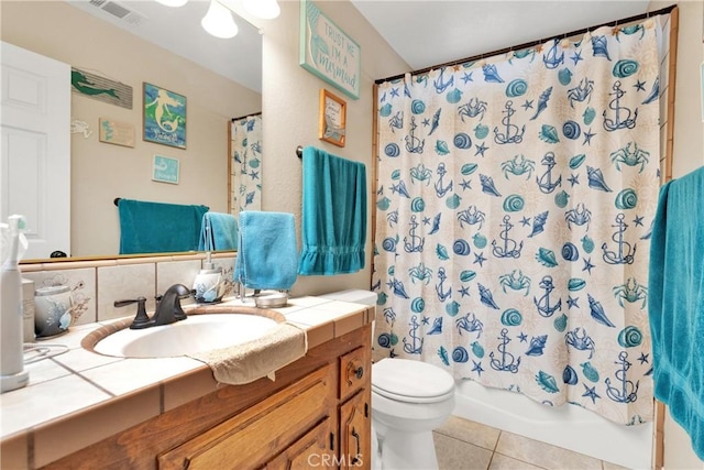 full bathroom with shower / tub combo, toilet, tile patterned floors, vanity, and backsplash