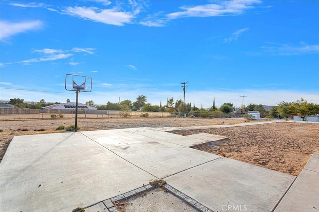 view of patio with basketball hoop