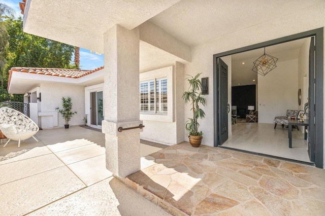 doorway to property featuring a patio