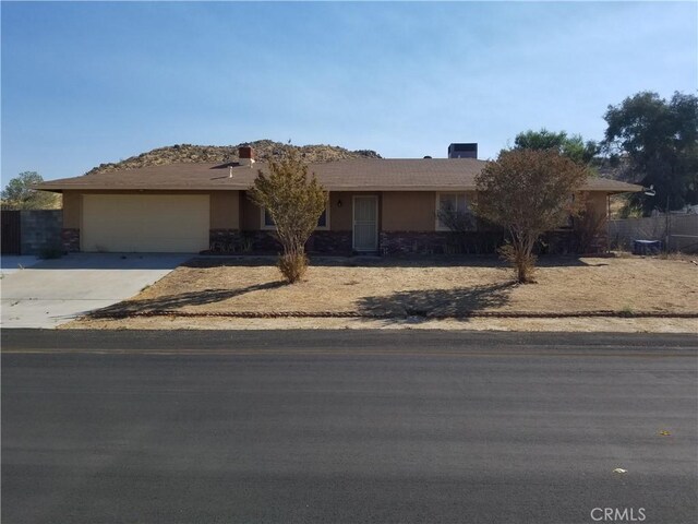 ranch-style home with a garage