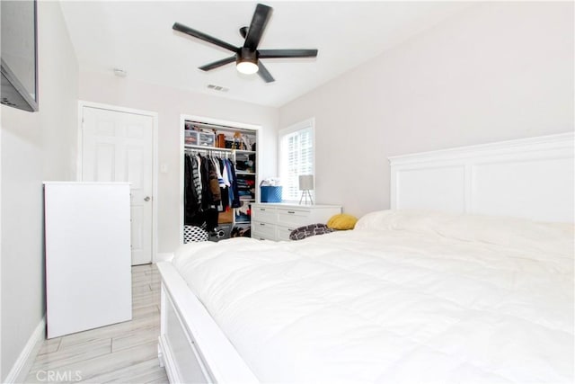 bedroom with ceiling fan and a closet