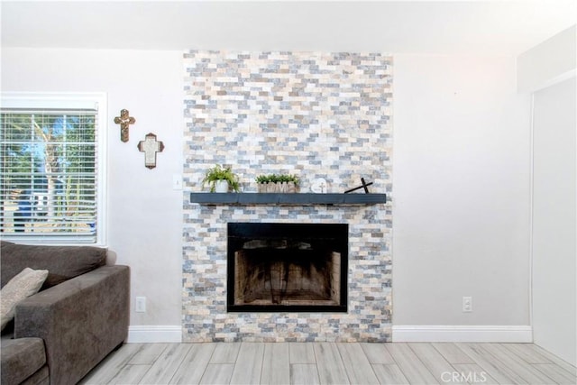 living room with a tiled fireplace