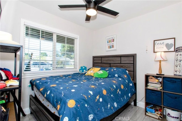 bedroom featuring ceiling fan and light wood-type flooring