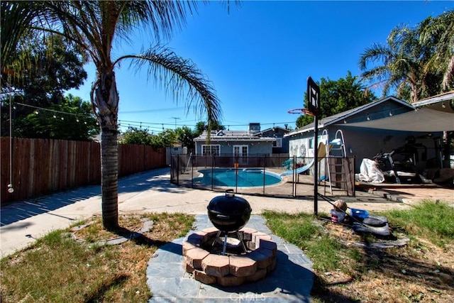 exterior space featuring a fenced in pool and a patio area