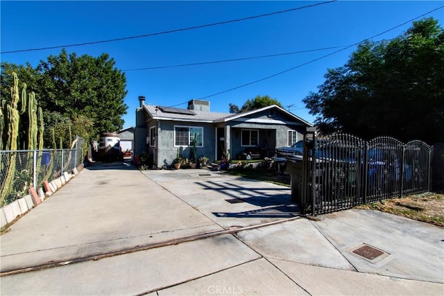 view of front of home featuring solar panels