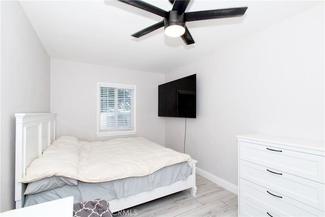 bedroom featuring light hardwood / wood-style floors and ceiling fan