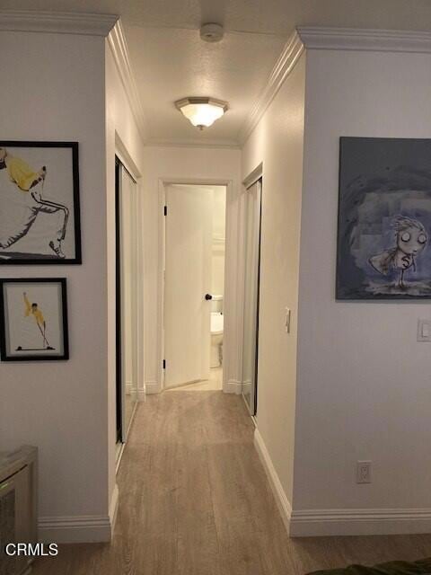 1340 E Hillcrest Dr Unit 8, Thousand Oaks, CA 91362 - hallway featuring wood finished floors and crown molding