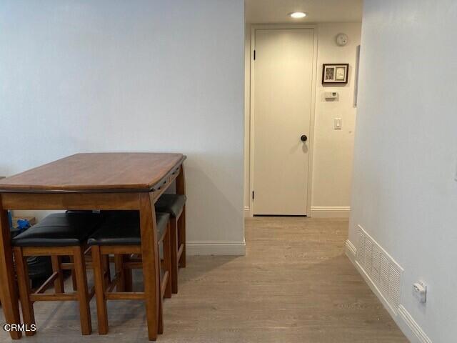 1340 E Hillcrest Dr Unit 8, Thousand Oaks, CA 91362 - hall featuring baseboards and light wood finished floors