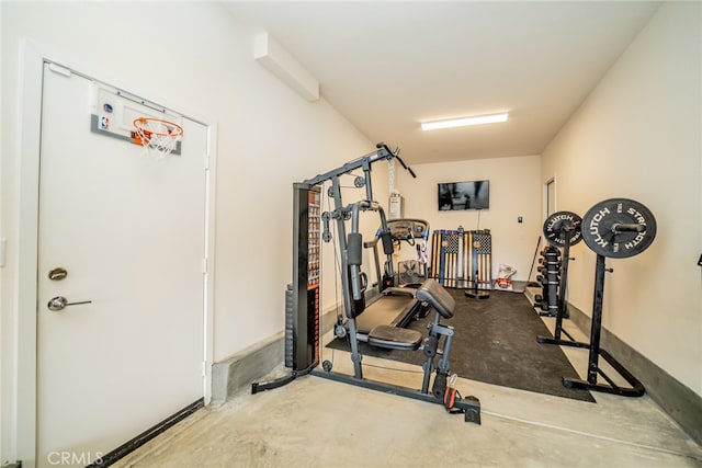 exercise room featuring concrete floors