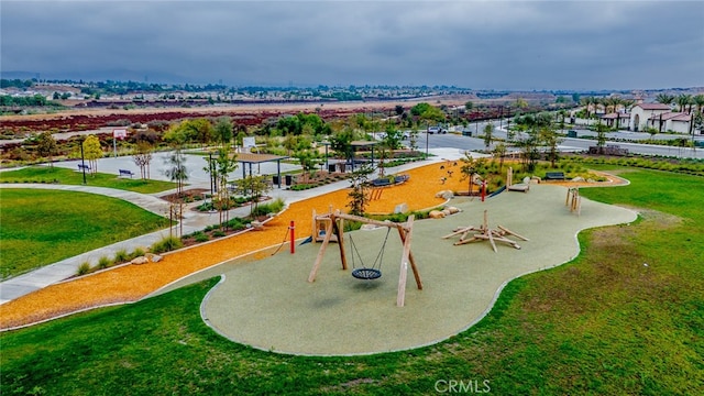 view of community with a lawn and a playground