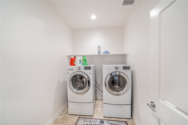 laundry area with separate washer and dryer