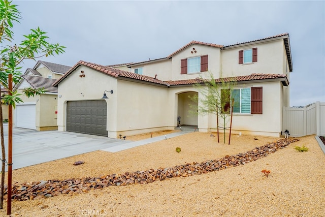 mediterranean / spanish-style house featuring a garage