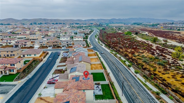 birds eye view of property with a mountain view