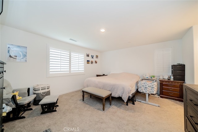 bedroom with light carpet