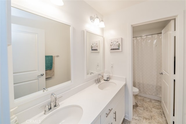 bathroom featuring vanity, a shower with curtain, and toilet