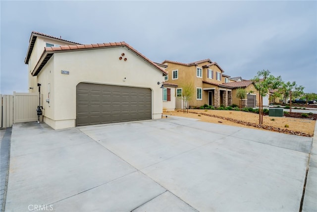 mediterranean / spanish-style home with a garage