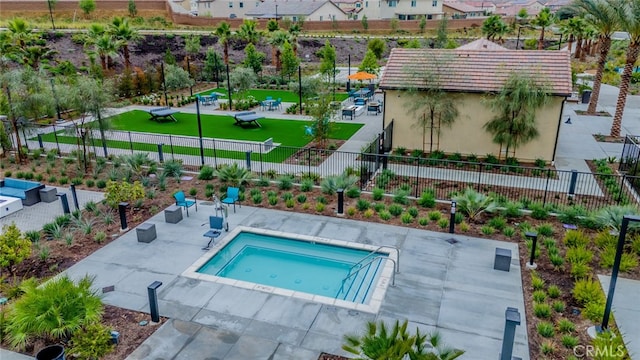 view of swimming pool with a patio and an in ground hot tub