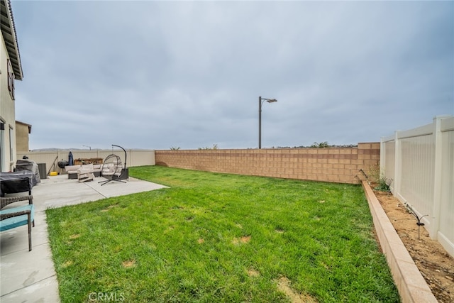 view of yard with an outdoor living space and a patio