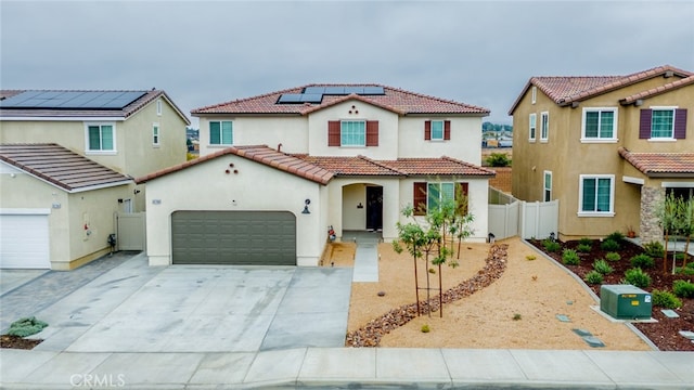 mediterranean / spanish house with solar panels and a garage