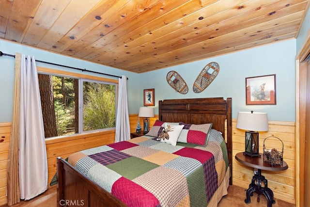 bedroom featuring wooden ceiling and wooden walls